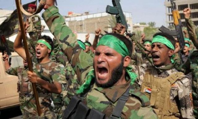 التايمز:مسلحو الحشد الشعبي في العراق يرفعون أعلام حزب الله