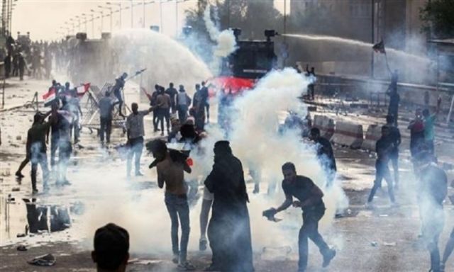التمثيل بجثة مدني قتل 4 متظاهرين في بغداد