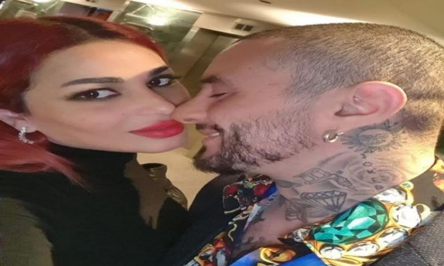 صور.. أحمد الفيشاوي وزوجته يتبادلان القبلات الساخنة احتفالا بأعياد الربيع