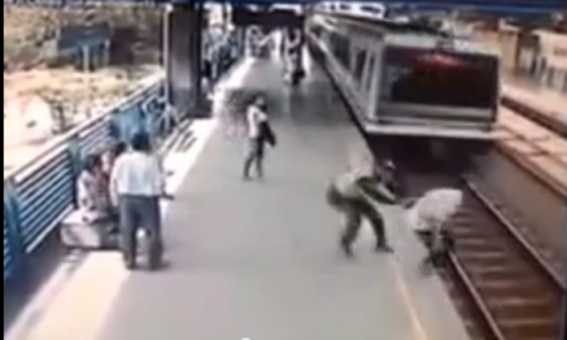 بالفيديو .. ضابط كولومبي ينقذ حياة ”منتحر” من أمام القطار السريع